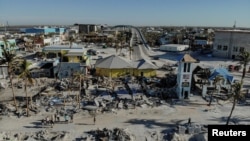 Remains of destroyed restaurants, shops and other businesses are seen almost one month after Hurricane Ian landfall in Fort Myers Beach, Florida, Oct. 26, 2022. 