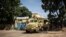 A military vehicle is seen in front of Burkina Faso national television, In Ouagadougou on Oct. 1, 2022.
