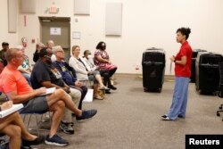 Monique Duncan-Jones, outreach and early voting manager trains poll workers amid heightened security measures ahead of the midterm elections at Leon County Supervisor of Elections office in Tallahassee, Florida, Oct. 5, 2022.