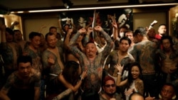 People with tattoos gather together for group photos at the annual gathering of the Irezumi Aikokai (Tattoo Lovers Association) in Tokyo, Japan, February 16, 2020. REUTERS/Kim Kyung-Hoon