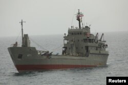 FILE - Drones stand at an Iranian military ship in the Indian Ocean in this handout image obtained on July 15, 2022. (Iranian Army/WANA Handout via REUTERS)