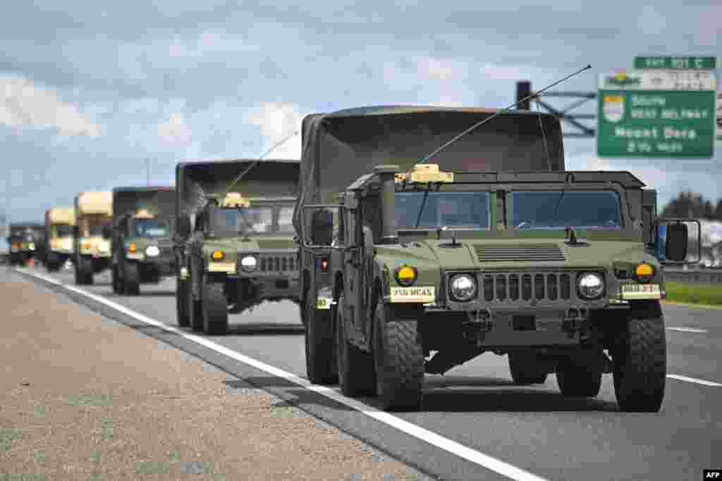 A military convoy is seen ahead of Hurricane Milton's expected mid-week landfall in Sanford, Florida, Oct. 8, 2024.&nbsp;