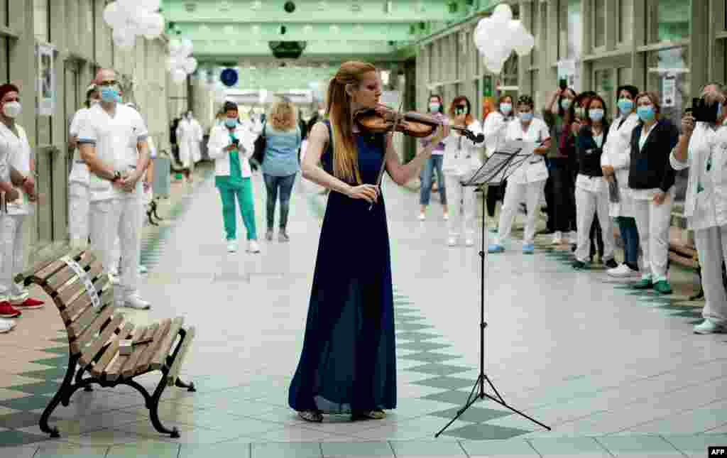 Italian violinist Fiamma Flavia Paolucci performs at Tor Vergata Hospital in Rome, as the world is marking International Nurses Day, during the country's partial lockdown aimed at curbing the spread of the COVID-19.