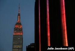 Orange lighting illuminates the Empire State Building in recognition of Gun Violence Awareness Month, Wednesday, June 1, 2016, in New York.
