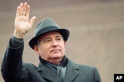 FILE - Soviet President Mikhail Gorbachev waves from the Red Square tribune during a Revolution Day celebration, in Moscow, Soviet Union, Tuesday, Nov. 7, 1989. (AP Photo/Boris Yurchenko, File)