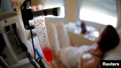 A patient receives chemotherapy treatment for breast cancer at the Antoine-Lacassagne Cancer Center in Nice July 26, 2012. Picture taken July 26, 2012.