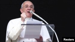 Pope Francis delivers his Sunday Angelus prayer in Saint Peter's square at the Vatican, Feb. 1 2015. 