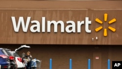 An internally displaced boy from northern provinces, who fled from his home due the fighting between Taliban and Afghan security forces, is comforted by his sister in a public park that they use as shelter in Kabul, Afghanistan.