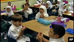 FILE - While many U.S. youngsters study foreign languages, such as Arabic at the Muslim Youth Academy in Dearborn, Michigan, at home plenty of them speak languages other than English. 