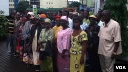 People attend court to hear charges against the agency that handled adoptions, (Nina deVries/VOA) 