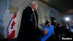 Canadian Public Safety Minister Vic Toews arrives to speak to journalists about the arrest of two men in an alleged teror plot, on Parliament Hill in Ottawa Apr. 22, 2013.