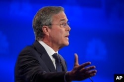 FILE - Jeb Bush speaks during the CNBC Republican presidential debate at the University of Colorado, Oct. 28, 2015, in Boulder, Colo.