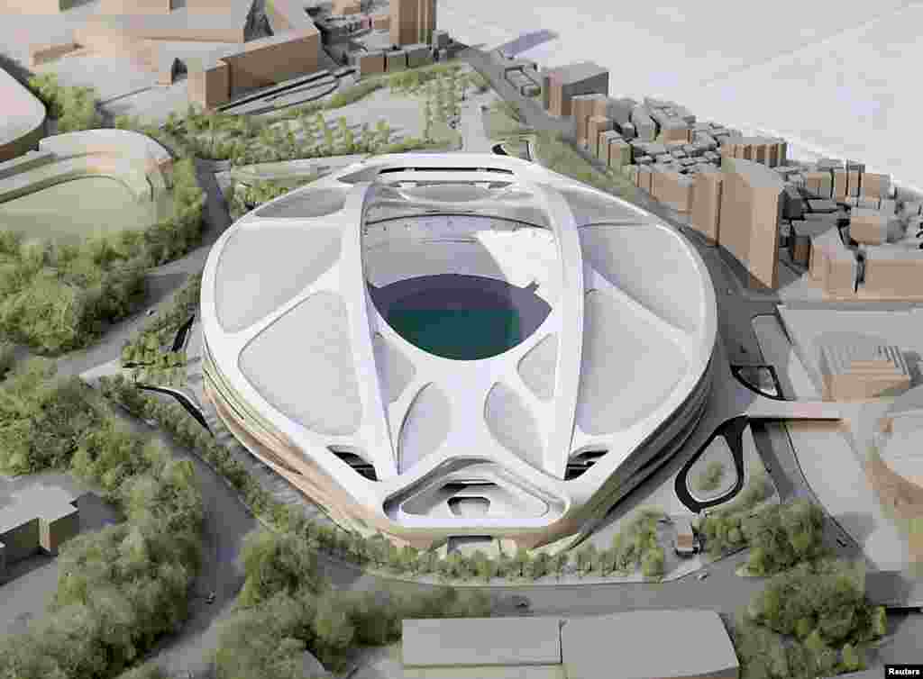 FILE - A rendering model of the new National Stadium for 2020 Tokyo Olympics and Paralympics, designed by Iraqi-British architect Zaha Hadid, is displayed at a meeting of members of the advisory council on the construction of the new stadium, in Tokyo, in this photo released by Kyodo, July 17, 2015.