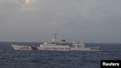 A Chinese Coast Guard ship sails in the East China Sea near the disputed isles known as Senkaku isles in Japan and Diaoyu islands in China in this picture taken and released by Japan's Coast Guard.