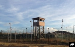 This Dec. 11, 2016 photo shows an unused guard tower at Camp Delta, one of the parts of the detention center at the U.S. Naval base at Guantanamo Bay, Cuba, that is now vacant.