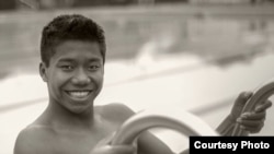 17 years-old Jordan Pisey Windle is a five-time national champion in diving and a member of the United States National Team. He was a two-years old orphan when he was adopted by his American father, Jerry Windle. (Courtesy Photo of Michael Thomas) 