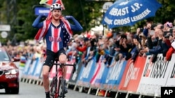 File- United States' Quinn Simmons celebrates at the World Championships in Harrogate, Sept. 26, 2019, England. He was suspended for social media comments supporting President Donald Trump in reply to a journalist from the Netherlands.