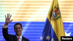 Venezuelan opposition leader Juan Guaido, who many nations have recognized as the country's rightful interim ruler, attends a forum to discuss a security plan for the country, in Caracas, Venezuela, April 11, 2019.