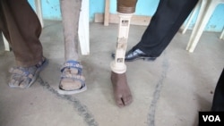 Bat-Galim Shaar, right, and Iris Yifrah, center, mothers of two of the three Israeli teens who were abducted and killed in the West Bank, mourn during the joint funeral of their sons in Modiin, July 1, 2014.