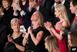 Carryn Owens, widow of widow of Chief Special Warfare Operator William “Ryan” Owens, is applauded on Capitol Hill in Washington, Tuesday, Feb. 28, 2017, as she was acknowledged by President Donald Trump