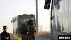 Dîmeneke çekdarên HTŞ li nêzîkî gundê Kefraya yê Îdlibê (arşîv).