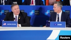 U.S. Secretary of State Mike Pompeo speaks as NATO Secretary General Jens Stoltenberg (R) listens during a meeting of the North Atlantic Treaty Organization (NATO) Foreign Ministers at the State Department in Washington, April 4, 2019.