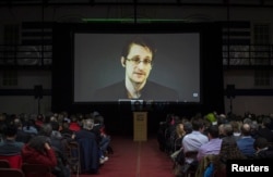 Former U.S. National Security Agency contractor Edward Snowden appears live via video during a student-organized world affairs conference at the Upper Canada College private high school in Toronto, Feb. 2, 2015.