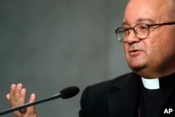FILE - Archbishop Charles Scicluna speaks during a press conference at the Vatican, Oct. 8, 2018.