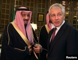U.S. Secretary of Defense Chuck Hagel is greeted by Saudi Crown Prince Salman bin Abdulaziz (L) in Riyadh, Dec. 9, 2013.