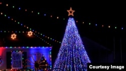 Christmas tree with colorful lights and stars in Kansas.