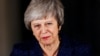 Britain's Prime Minister Theresa May speaks outside 10 Downing Street after a confidence vote by Conservative Party Members of Parliament (MPs), in London, Britain, Dec. 12, 2018.