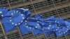 European Union flags flutter outside the EU Commission headquarters in Brussels, Belgium May 5, 2021. REUTERS/Yves Herman