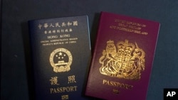 A British National Overseas passports (BNO) and a Hong Kong Special Administrative Region of the People's Republic of China passport are pictured in Hong Kong, Friday, Jan. 29, 2021. China said Friday it will no longer recognize the British National…