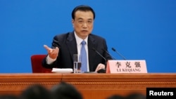 Chinese Premier Li Keqiang speaks at a news conference following the closing session of the National People's Congress (NPC) at the Great Hall of the People in Beijing, March 15, 2019. 