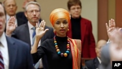 State Rep. Ilhan Omar takes the oath of office as the 2017 Legislature convened Tuesday, Jan. 3, 2017, in St. Paul, Minn.