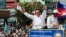In this June 2, 2017, file photo, opposition party Cambodia National Rescue Party (CNRP) leader Kem Sokha greets his supporters at a rally in Phnom Penh.