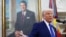 Дональд Трамп в Овальном кабинете Белого дома, на фоне портрета президента Рональда Рейгана. 12 февраля 2025 года. REUTERS/Nathan Howard.
