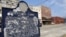 FILE - A plaque describing the origins of the city is seen in Forrest City, Arkansas, Feb. 27, 2009.