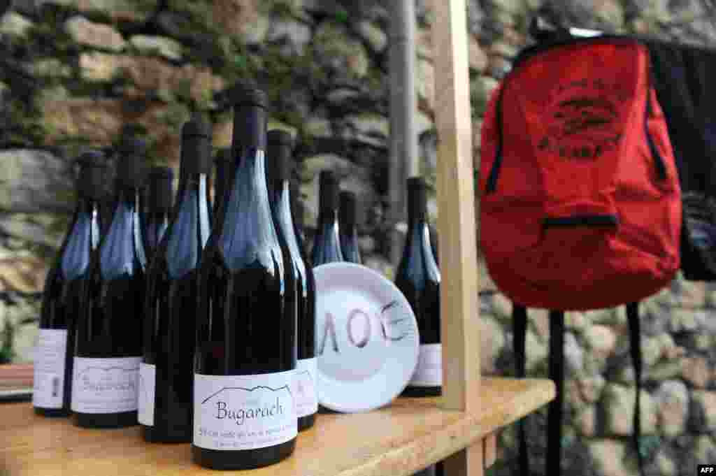 Bottles of wine and backpacks are proposed to visitors at the "Bug' boutic" (Bugarach shop) of the "Amis du Pic" (Peak's friends) association, on December 20, 2012.
