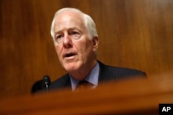 FILE - Senate Majority Whip Sen. John Cornyn, R-Texas, speaks during a hearing on Capitol Hill, May 8, 2019.