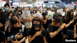 Anti-government protesters sing a protest song "Glory to Hong Kong" during a sit-in at Yoho mall, at Yuen Long MTR station, in Hong Kong, China September 21, 2019. REUTERS/Tyrone Siu 