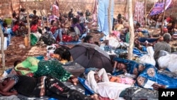 Ethiopian refugees who fled fighting in Tigray province lay in a hut at the Um Rakuba camp in Sudan's eastern Gedaref province, Nov. 16, 2020.