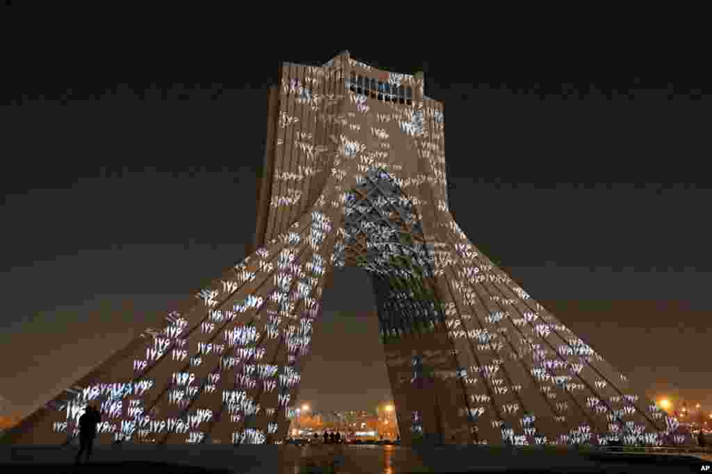 The video mapping is projected on Tehran's iconic Azadi(freedom) tower to commemorate 176 victims of the Ukrainian flight during a municipal memorial marking the first anniversary of the plane crash, in Tehran, Iran.