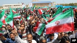 M23 rebel fighters are seen walking up a hill overlooking Goma, six kilometers from the center of the eastern Congo city, December 3, 2012.