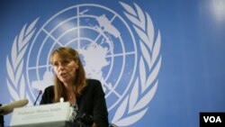 A couple takes a selfie at Nokonoshima Island Park on Nokonoshima Island, in Hakata Bay, Fukuoka prefecture, Japan, as the early-blooming cosmos flowers cover the park's 10,000-square-foot slope in pink and purple.