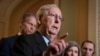 Senate Majority Leader Mitch McConnell, R-Ky., joined by Majority Whip John Thune, R-S.D., left, and Sen. Joni Ernst, R-Iowa, talks to reporters at the Capitol in Washington, Jan. 7, 2020. 