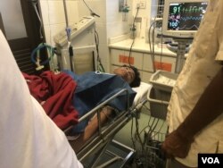 Kak Kea, 18, a worker, survived in the rubble of a collapsed building in Sihanoukville for more than 2½ days, June 24, 2019 (Sun Narin/VOA Khmer)