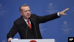 Turkey's President Recep Tayyip Erdogan gestures as he delivers his speech in the opening session of the Organisation of Islamic Cooperation Extraordinary Summit in Istanbul, Wednesday, Dec. 13, 2017. (AP)