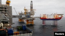 FILE PHOTO: Equinor's Johan Sverdrup oilfield platforms and accommodation jack-up rig Haven are pictured in the North Sea, Norway December 3, 2019. REUTERS/Ints Kalnins/File Photo
