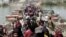Displaced Sunni people fleeing Ramadi cross a bridge outside Baghdad, May 24, 2015. Iraqi forces recaptured territory from advancing Islamic State militants near the recently fallen city of Ramadi on Sunday.